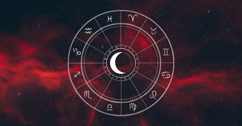 Dark zodiac wheel with astrological symbols surrounded by dramatic red cosmic clouds and glowing celestial energy