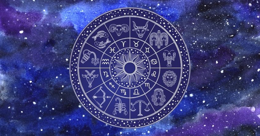 Glowing zodiac wheel with astrological symbols surrounded by deep purple and blue cosmic clouds