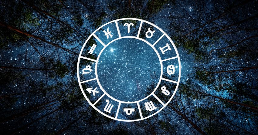Glowing blue zodiac wheel with astrological symbols surrounded by dark textured cosmic energy