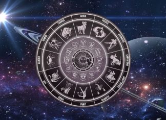 Weekend Horoscope for September 12-13: Karma Knows Exactly What You Deserve Glowing zodiac wheel with astrological symbols surrounded by stars and deep blue cosmic energy