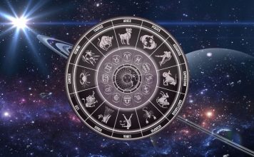 Weekend Horoscope for September 12-13: Karma Knows Exactly What You Deserve Glowing zodiac wheel with astrological symbols surrounded by stars and deep blue cosmic energy