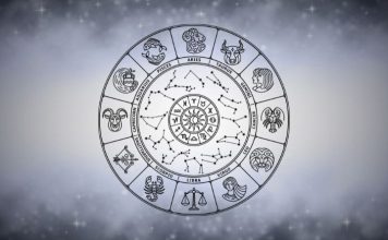 The Days Ahead Bring Heartache — Prepare Yourself Silver zodiac wheel with astrological symbols surrounded by soft gray mist on a bright celestial background