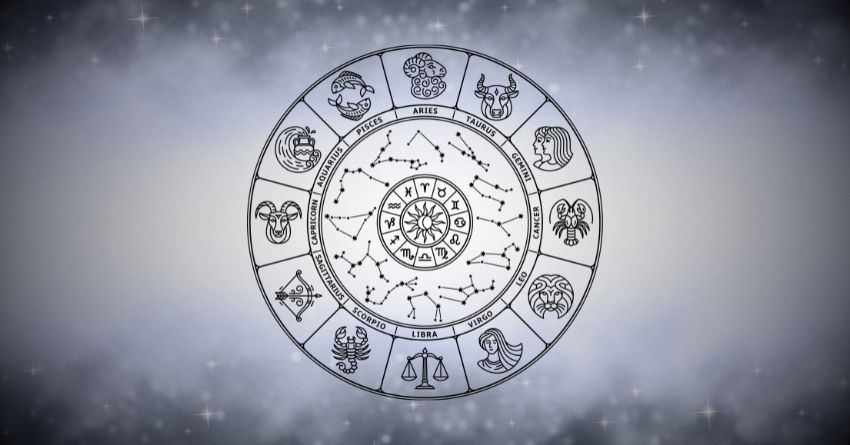 The Days Ahead Bring Heartache — Prepare Yourself Silver zodiac wheel with astrological symbols surrounded by soft gray mist on a bright celestial background